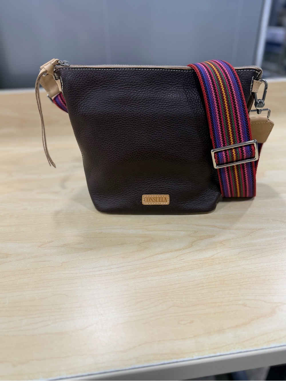 Consuela Dark Brown leather purse w/pink striped strap